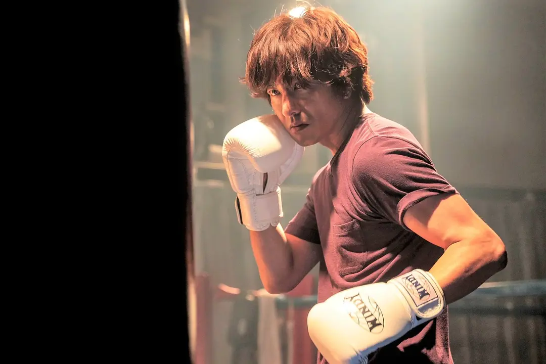 The boxer from "To The Future 10 Count" is ready for a fight in a boxing stance.